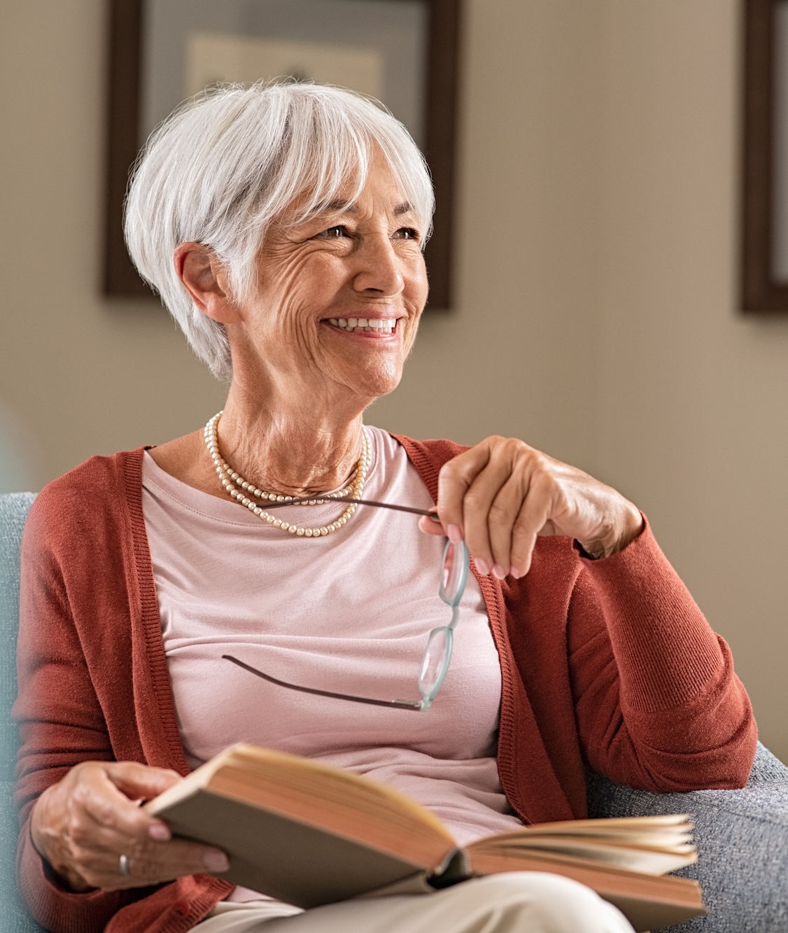 Smiling woman reading a book